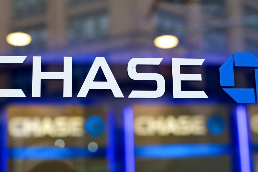 FILE - This Sept. 13, 2014, file photo, shows the Chase bank logo in New York. JPMorgan Chase says profits improved marginally in the third quarter, a notable change after the nation’s largest bank had to set aside billions in the last two quarters to cover losses from the coronavirus pandemic. The New York-based bank said it earned a profit of $9.44 billion, or $2.92 a share, in the July to September period. (AP Photo/Frank Franklin II, File)