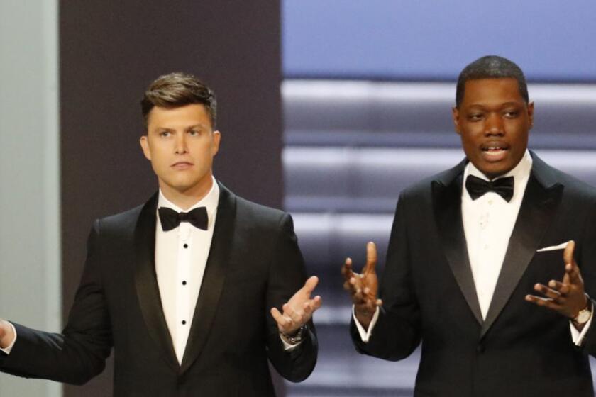 LOS ANGELES, CA., September 17, 2018: ? Hosts Colin Jost and Michael Che during the show at the 70th Primetime Emmy Awards at the Microsoft Theater?in Los Angeles, CA. (Brian van der Brug / Los Angeles Times)