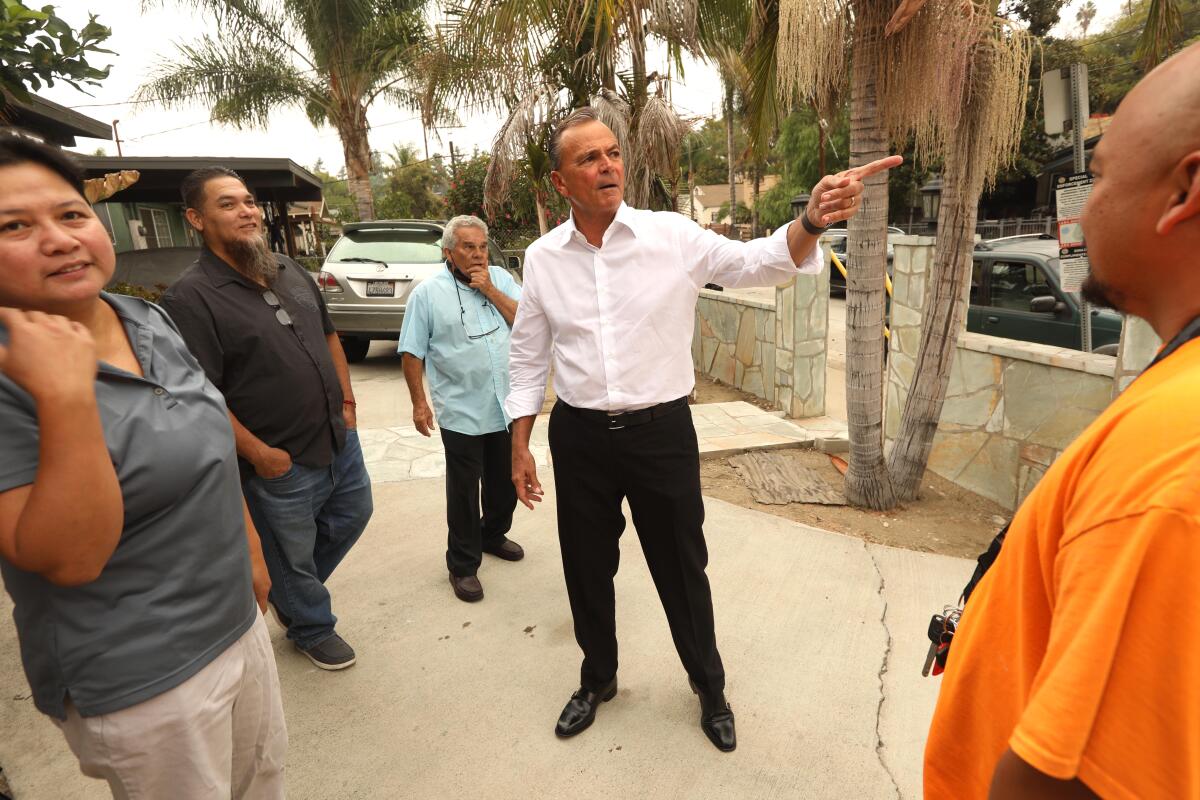 Los Angeles mayoral candidate Rick Caruso speaks to residents of Highland Park on Oct. 14. 