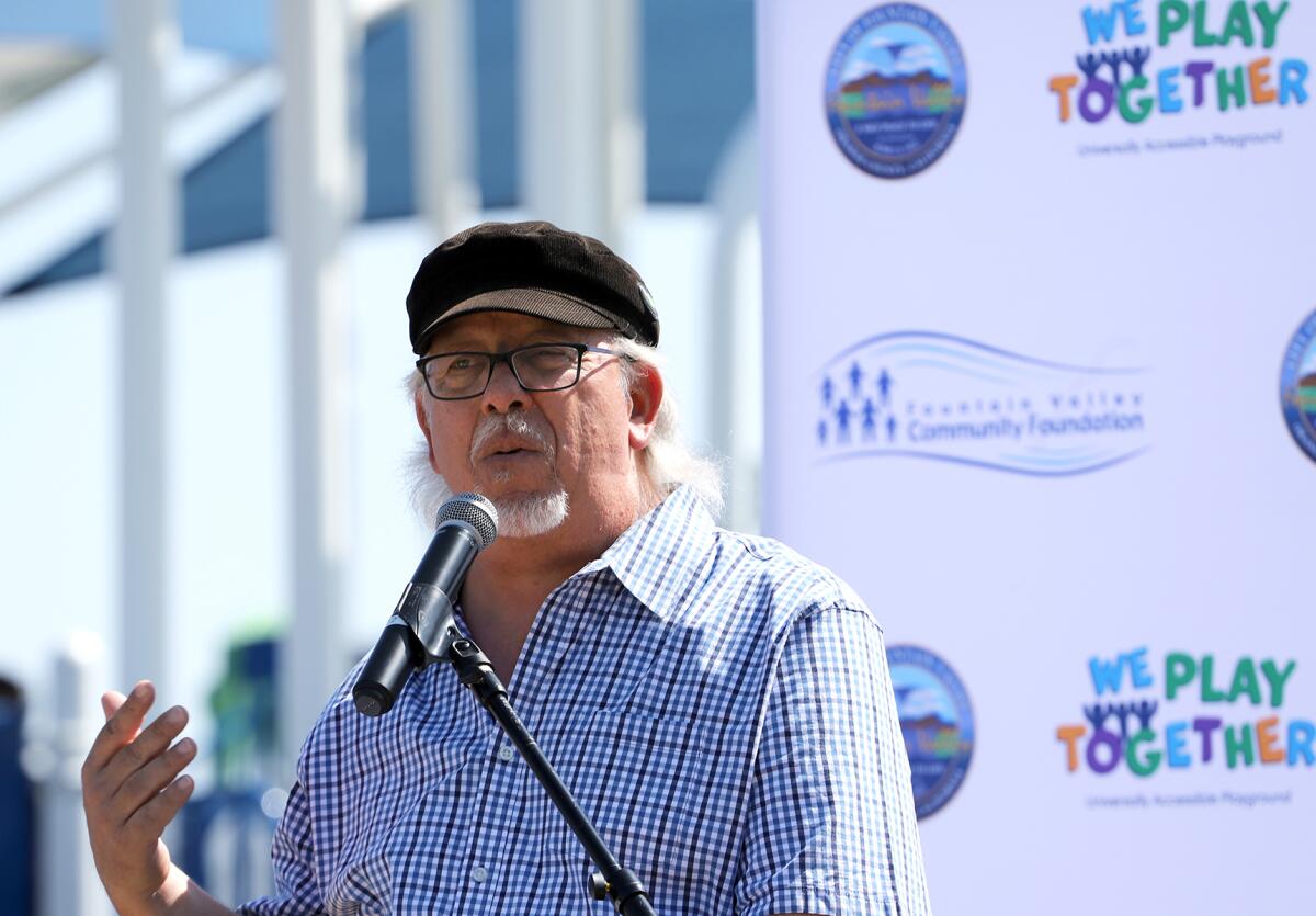 John Borack, the chairman of the Advisory Committee for Persons with Disabilities, speaks at Friday's ribbon-cutting event.