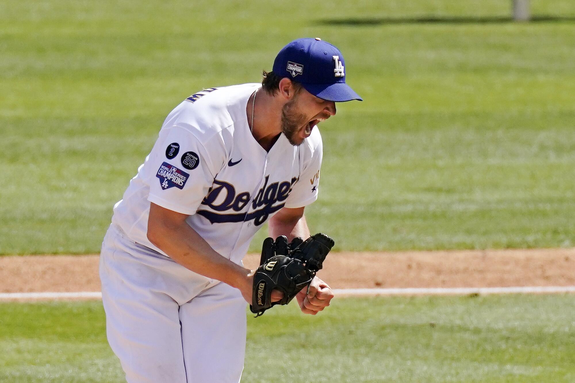 Los Angeles Dodgers starting pitcher Clayton Kershaw celebrates after striking out Washington Nationals' Jordy Mercer.