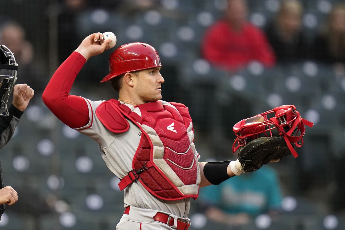 Angels catcher Max Stassi tosses a ball back to the mound against the Seattle Mariners on May 1.
