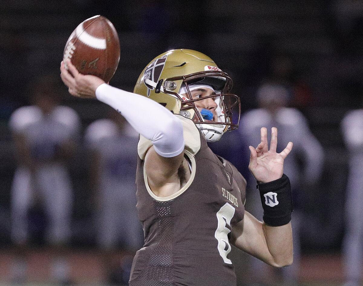 St. Francis' quarterback Jack Clougherty throws downfield against Cathedral in an Angelus League boys' football game at St. Francis High School on Friday, November 1, 2019. At halftime, St. Francis was leading 24-0.
