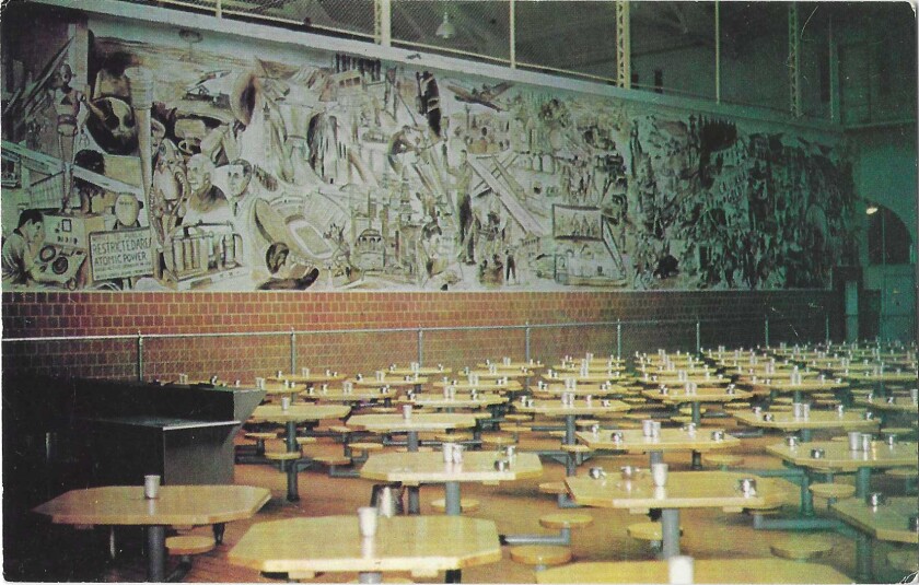 An inmate-painted mural in the San Quentin dining room includes places, people and events from history