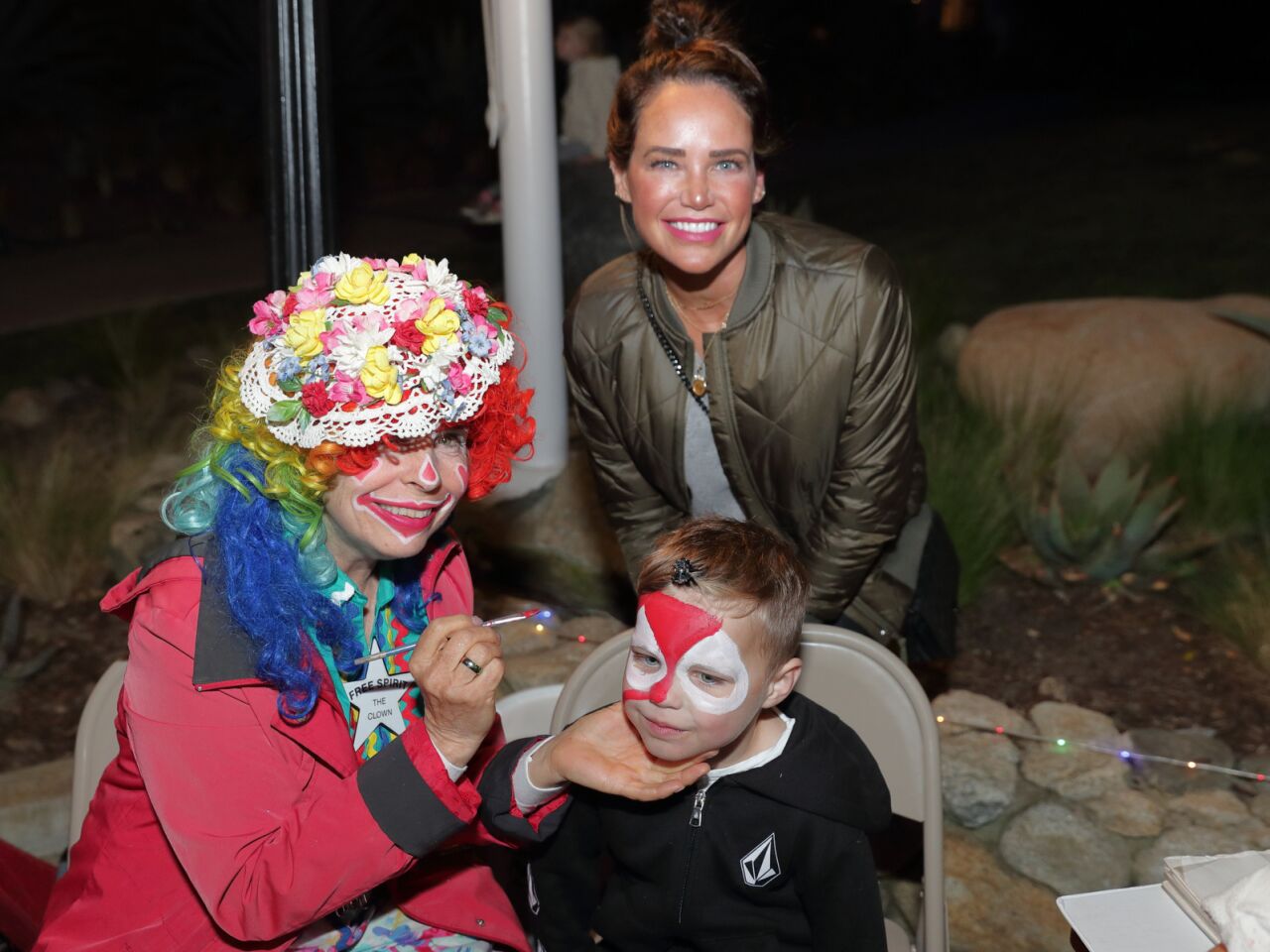 Mandy and Townsend Handy with the clown face painter