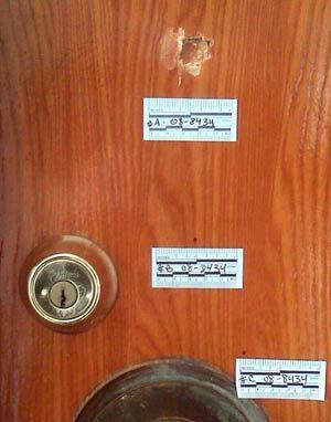 Bullet hole in Inglewood apartment door