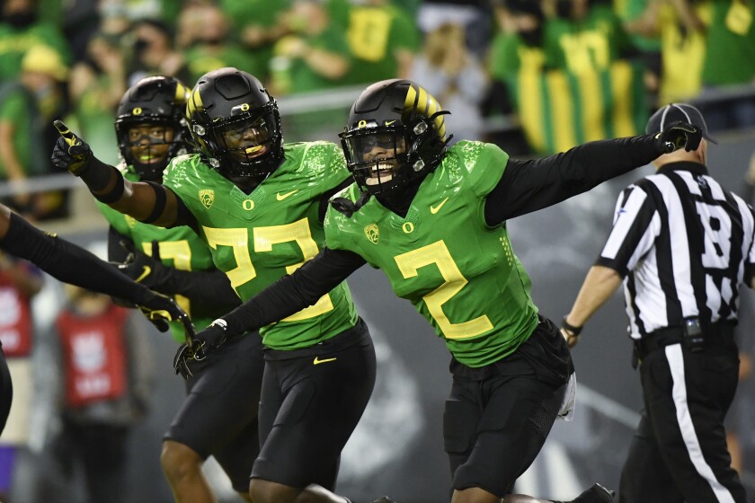 Oregon cornerback Mykael Wright (2) celebrates his interception Sept. 25, 2021.
