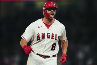 Los Angeles Angels' Mike Moustakas (8) runs the bases after hitting a home run during the sixth inning of a baseball game against the Los Angeles Angels in Anaheim, Calif., Wednesday, Aug. 9, 2023. Shohei Ohtani and Brandon Drury also scored. (AP Photo/Ashley Landis)