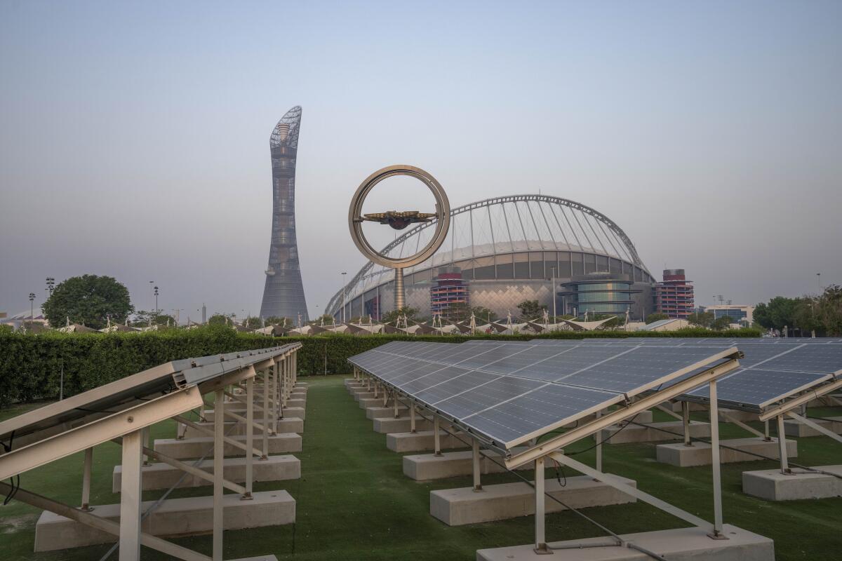 Solar panels sit in front of Khalifa International Stadium, also known as Qatar's National and oldest Stadium, which will host matches during FIFA World Cup 2022, in Doha, Qatar, Saturday, Oct. 15, 2022. Organizers of the 2022 World Cup in Qatar have said the event will be soccer’s first “carbon neutral” event of its kind. FIFA and Qatari organizers say they will reduce and offset all the event's carbon emissions, which will be calculated once the games are over. (AP Photo/Nariman El-Mofty)