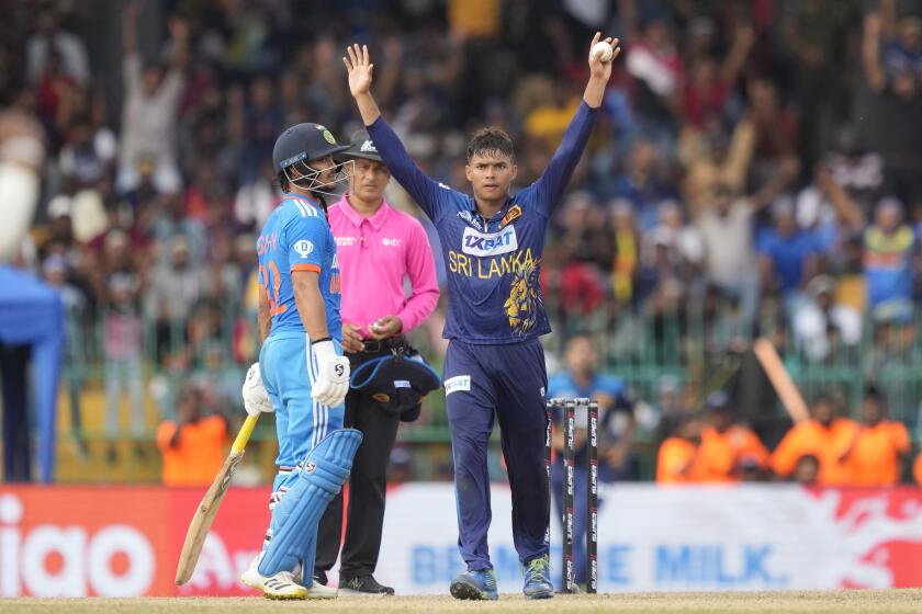 Sri Lanka's Dunith Wellalage, without a cap, celebrates taking the wicket of India's KL Rahul during the Asia Cup cricket match between Sri Lanka and India in Colombo, Sri Lanka, Tuesday, Sept. 12, 2023. (AP Photo/Eranga Jayawardena)
