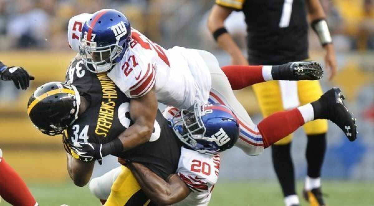 Football's foes say the game is dangerous, but are their fears supported by the facts? Above, the Pittsburgh Steelers and New York Giants face off in an NFL preseason game Saturday.
