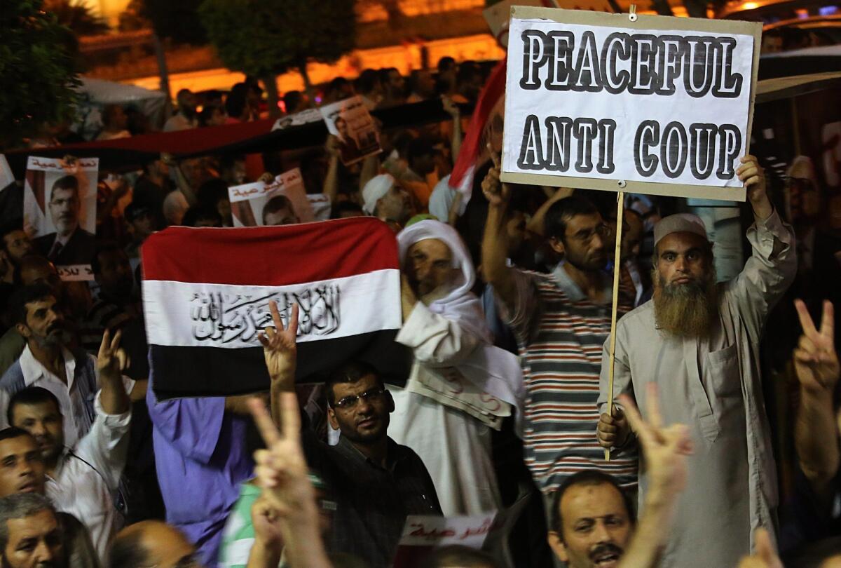 Supporters of Egypt's deposed President Mohamed Morsi rally in Cairo's Nasr city district.