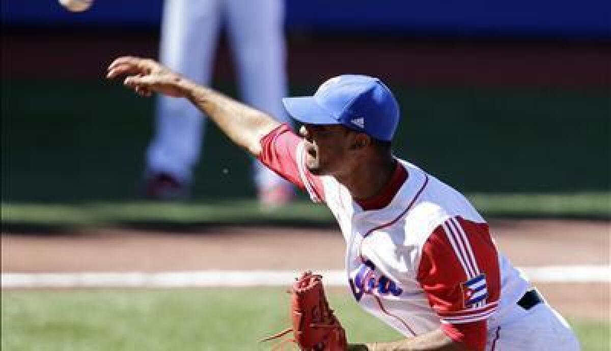 Miguel Alfredo Gonzalez pitches against Mexico in 2011.