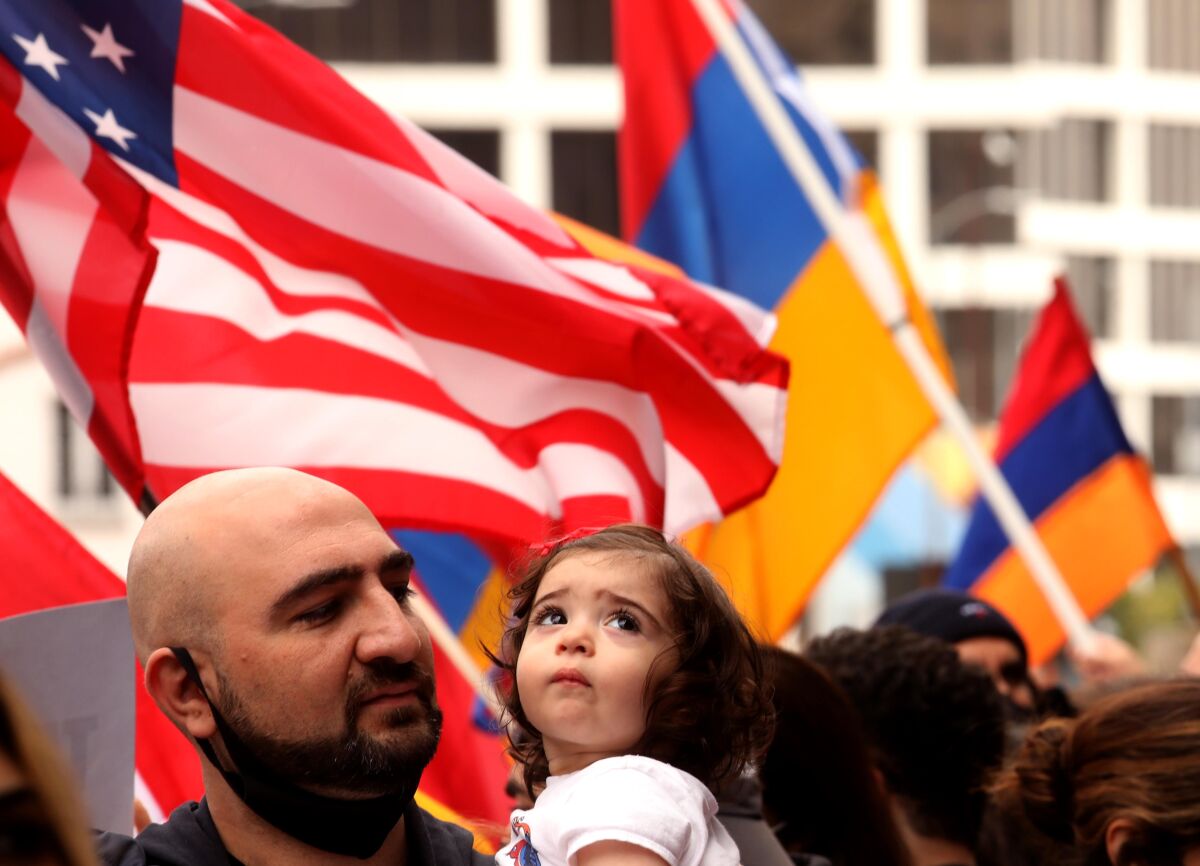 Mher Ghazaryan and his daughter Lili join hundreds from the Armenian community.