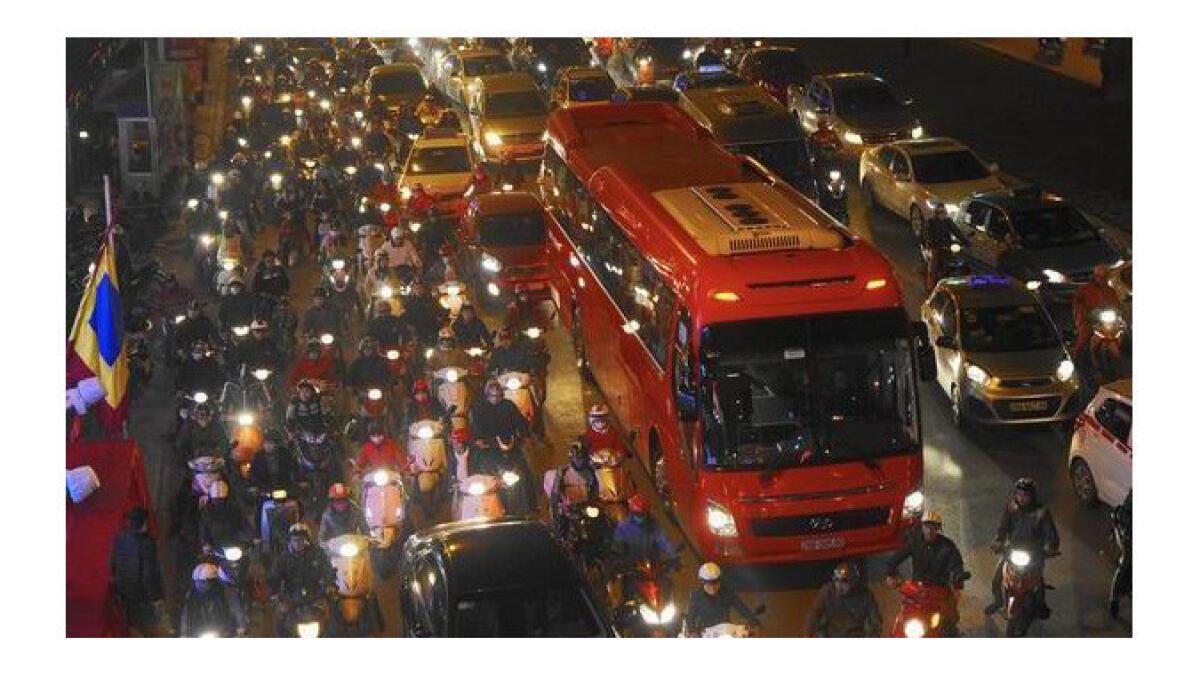 Hanoi traffic teems with scooters, buses, compact cars -- and now the occasional Rolls-Royce.