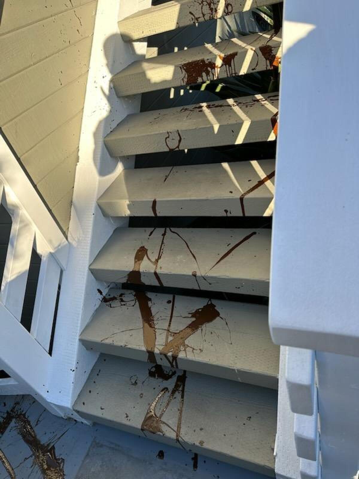 Feces smeared on stairs leading to a home