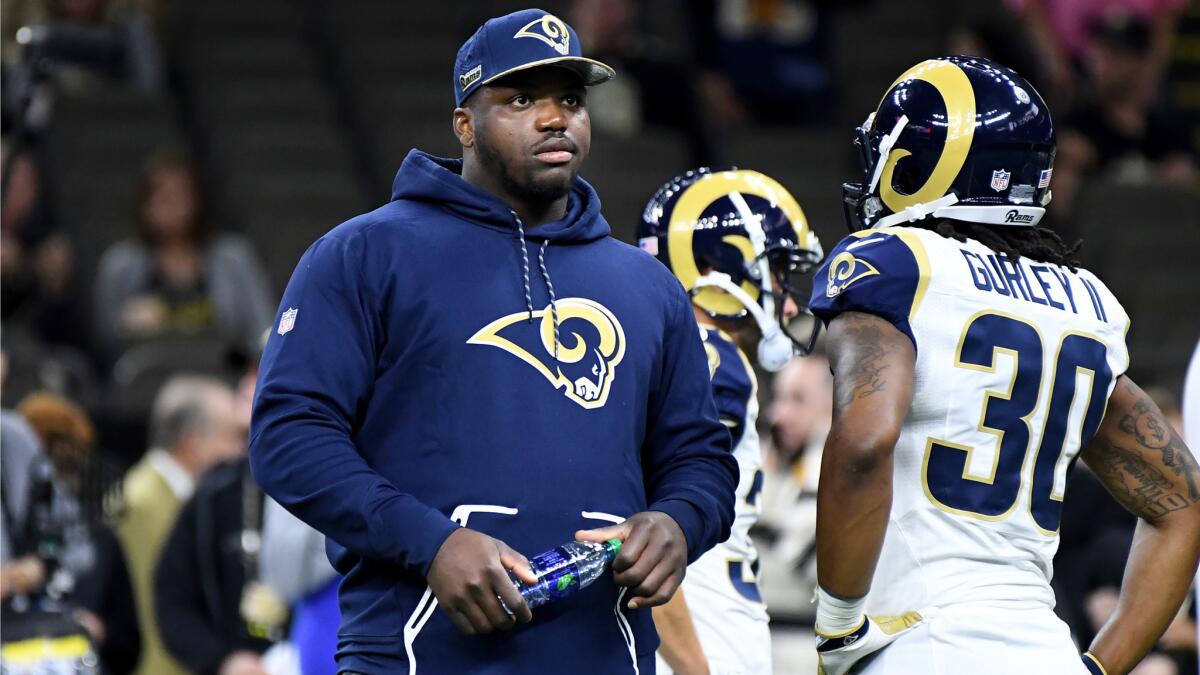 Rams' Greg Robinson can only watch as he did not suit up for the game against the New Orleans Saints on Sunday.
