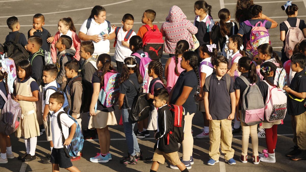 Students form lines on the playground as they prepare to go to their classroom on the first day at Dolores Huerta Elementary School in Los Angeles in August.