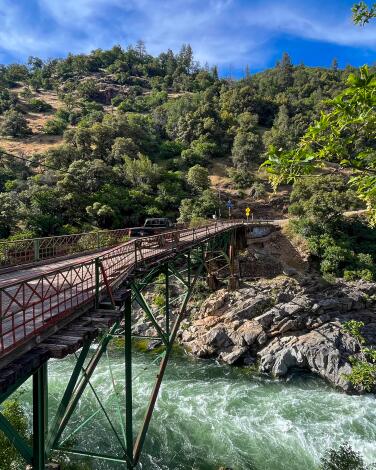 The South Yuba River roars under the historic Edwards Crossing Bridge outside Nevada City, Ca.