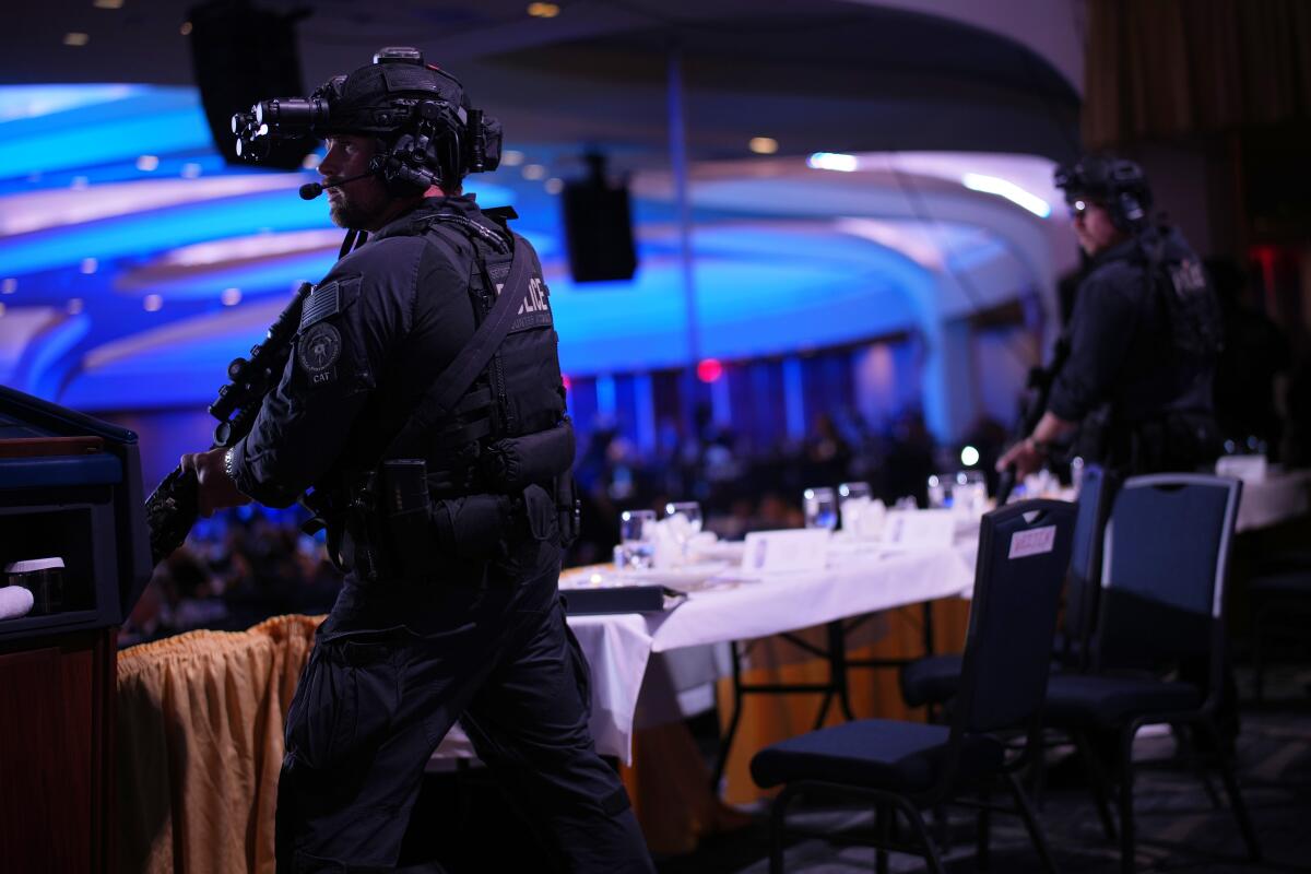 Agents stand guard after an incident at the White House Correspondents' Dinner.