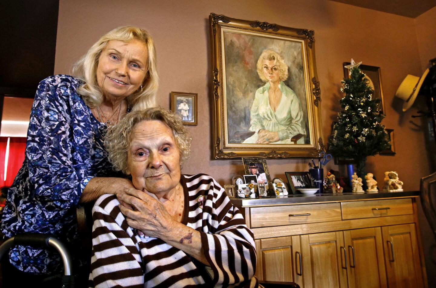 Patricia Hamlin, left, and her biological mother Brooke Mayo, are photographed at Brooke's home in Paso Robles. Patricia looks uncannily like a painting of Brooke that was done in the 1970s.
