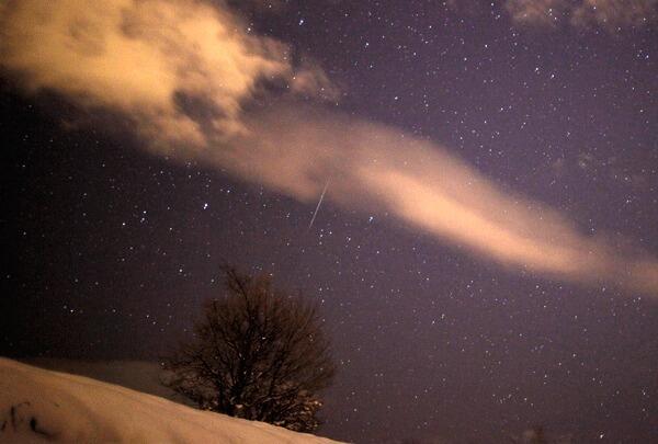 A meteor streaks past stars in the night sky over the village of Pesevici, near Zenica, 80 km (49 miles) from the capital Sarajevo, December 14, 2012.