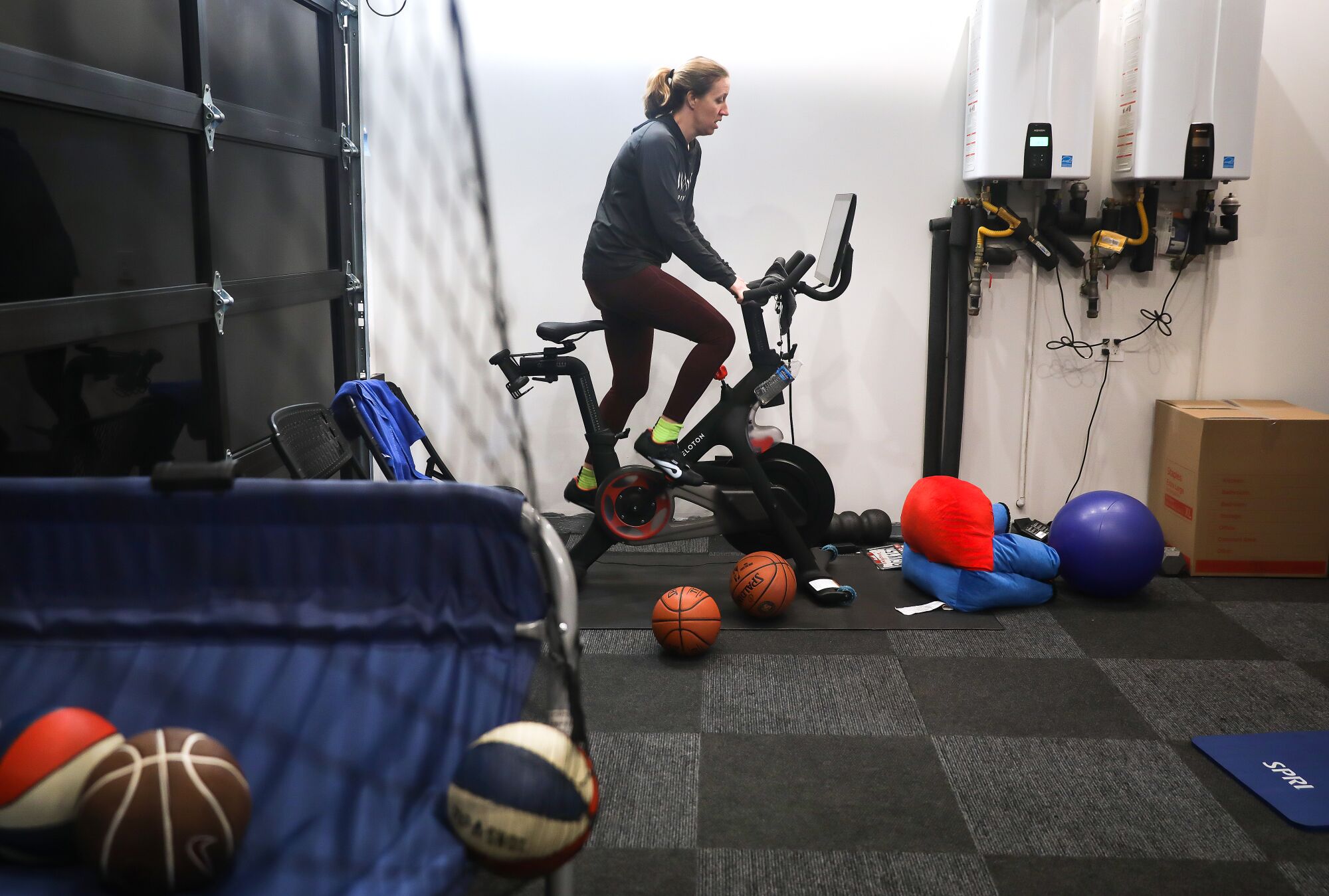 Lindsay Gottlieb squeezes in a short Peloton ride at home before heading to practice.