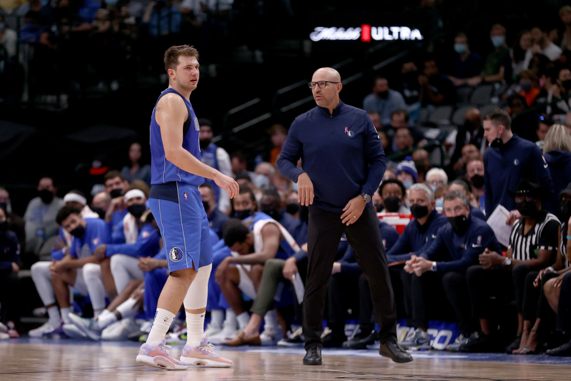 Dallas Mavericks star Luka Doncic speaks with coach Jason Kidd during a game against the Sacramento Kings in October.