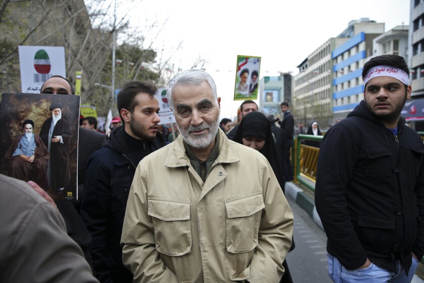 FILE -- In this Feb. 11, 2016 file photo, Revolutionary Guard Gen. Qassem Soleimani, center, attends an annual rally commemorating the anniversary of the 1979 Islamic revolution, in Tehran, Iran. Soleimani was killed in a U.S. airstrike in Iraq Thursday.