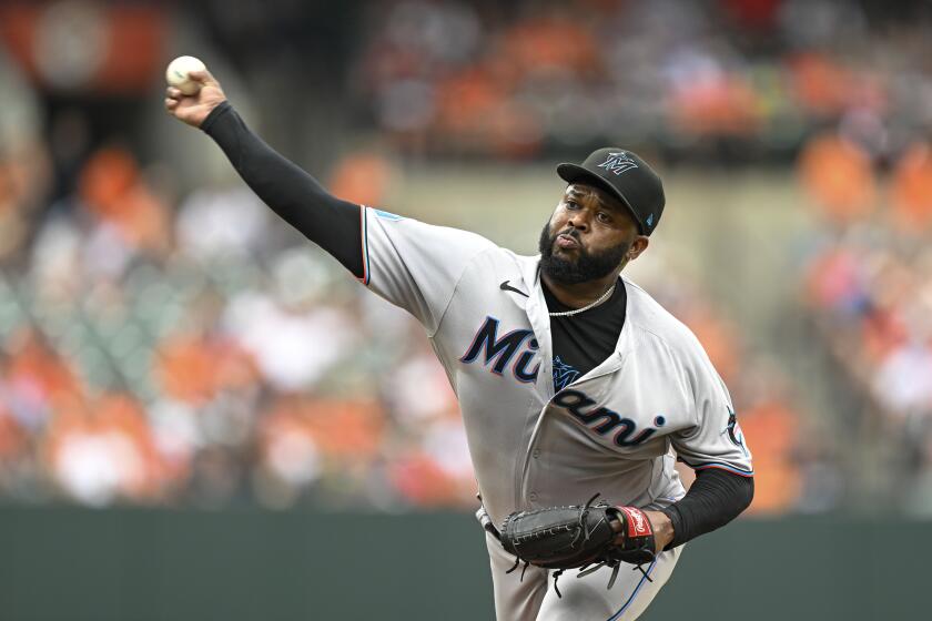 FILE -Miami Marlins relief pitcher Johnny Cueto throws during the fifth inning of a baseball game against the Baltimore Orioles, Sunday, July 16, 2023, in Baltimore. Two-time All-Star pitcher Johnny Cueto has signed a minor league contract with the Texas Rangers, Tuesday, April 23, 2024. (AP Photo/Terrance Williams, File)