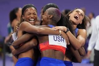 The United States' women 4x400-meter relay team celebrates winning the gold medal at the 2024 Summer Olympics, Saturday, Aug. 10, 2024, in Saint-Denis, France. (AP Photo/Matthias Schrader)