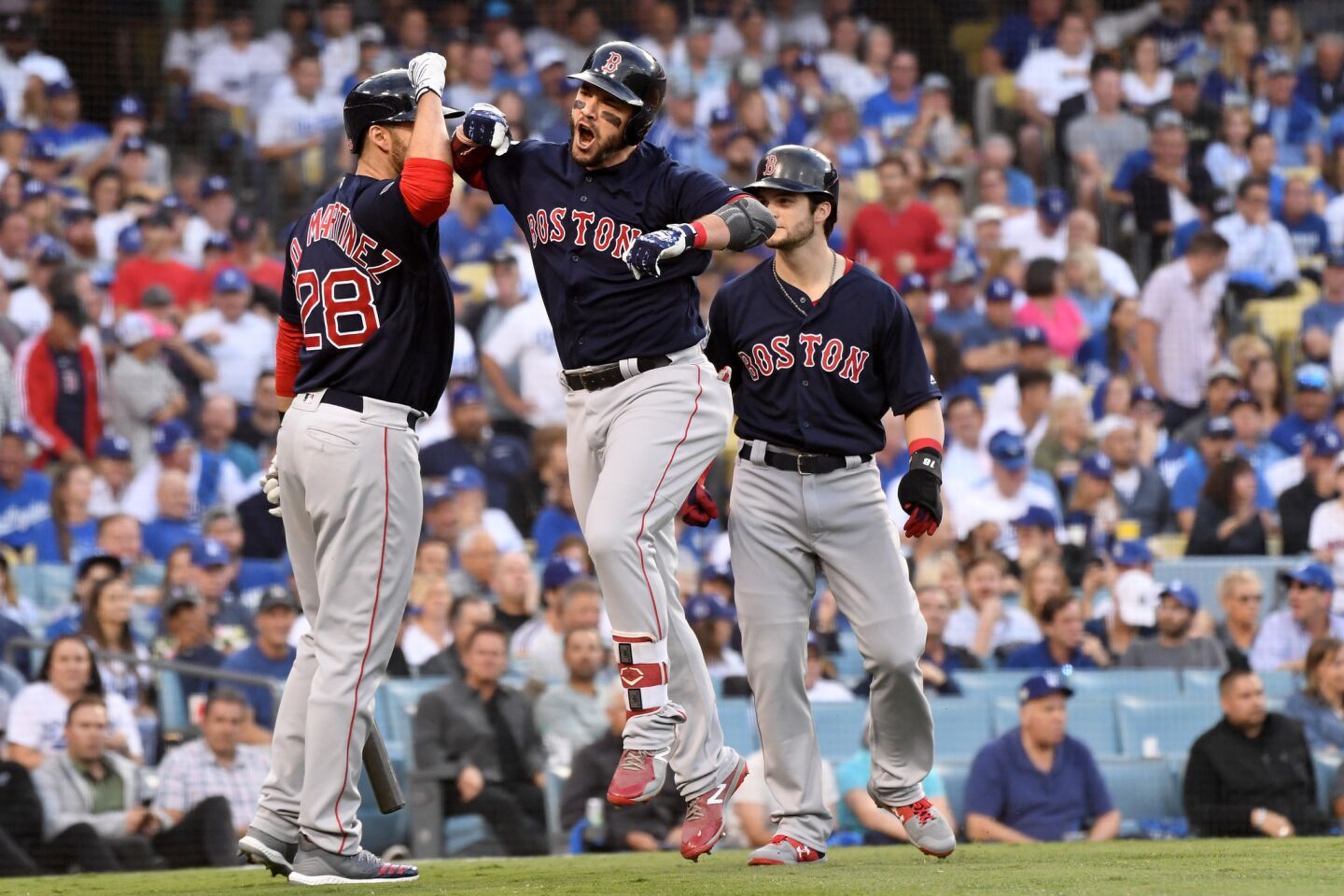 Red Sox Steve Pearce, center, celebrates his two-run home run aganinst the Dodgers in the 1st inning.