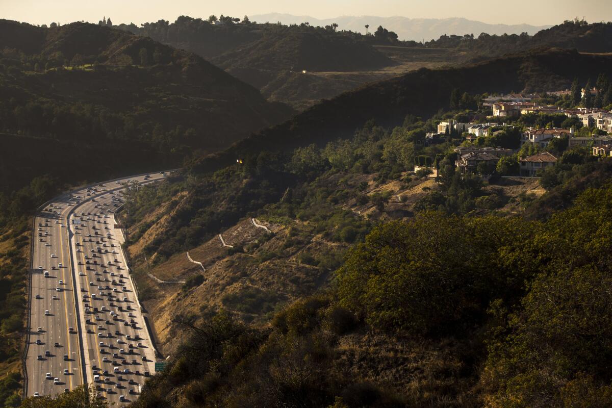 Traffic streams into the Sepulveda Pass below the Getty Museum on the 405 Freeway in Los Angeles. The 405 is a bypass of 5 Freeway, running west of the 5 south from Irvine to the northern San Fernando Valley.