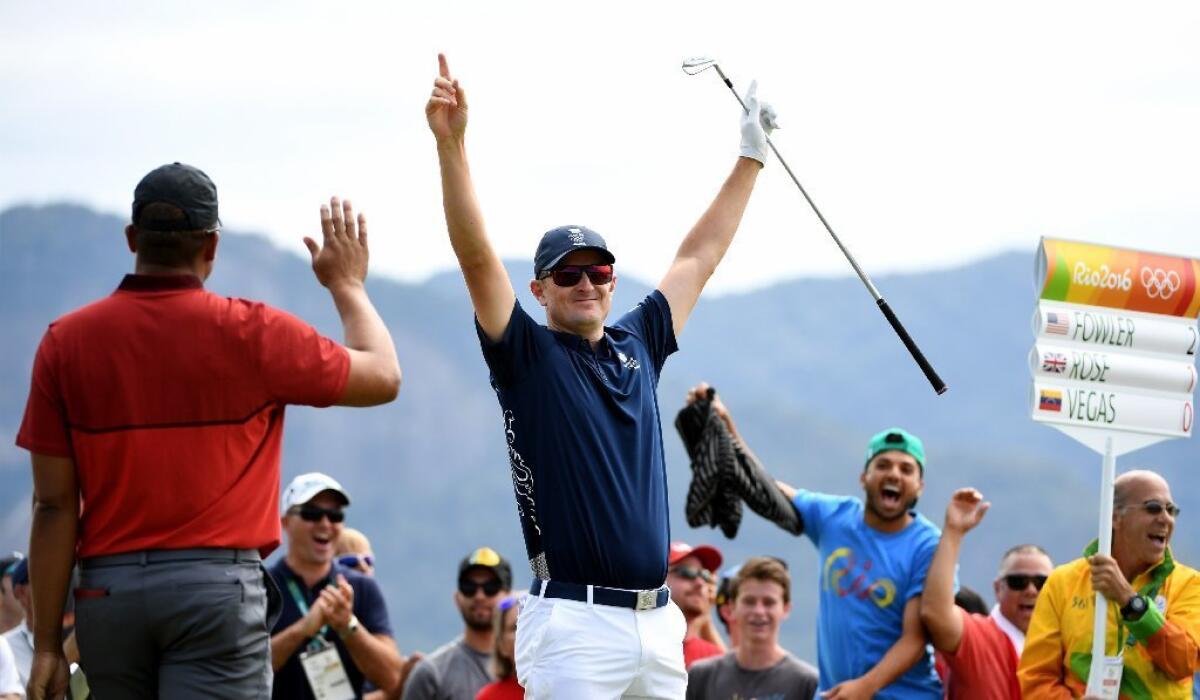 Justin Rose celebrates after hitting a hole-in-one during the Olympic golf tournament.