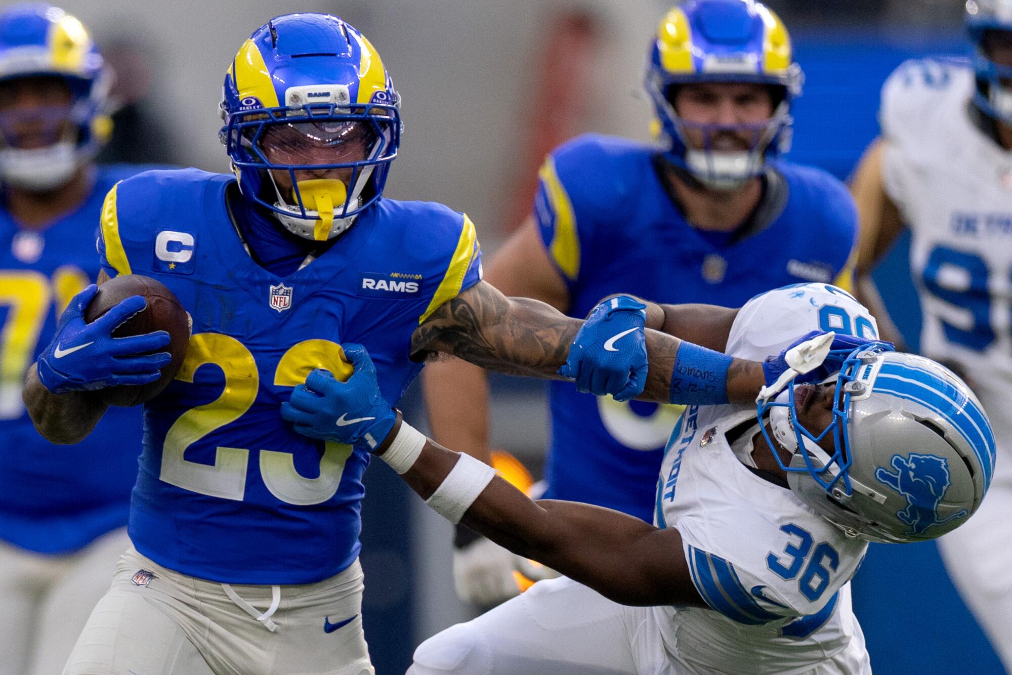 Commentary: No jinx, solely actuality. Rams are going to win a Tremendous Bowl championship 4 Rams running back Kyren Williams stiff-arms Detroit Lions safety Erick Hallett II during the first half Sunday.
