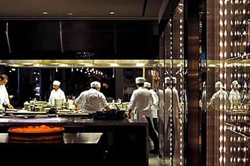 VIEWS: RH in the Andaz has an open kitchen with marble counters, a central island and glass-fronted refrigerators.