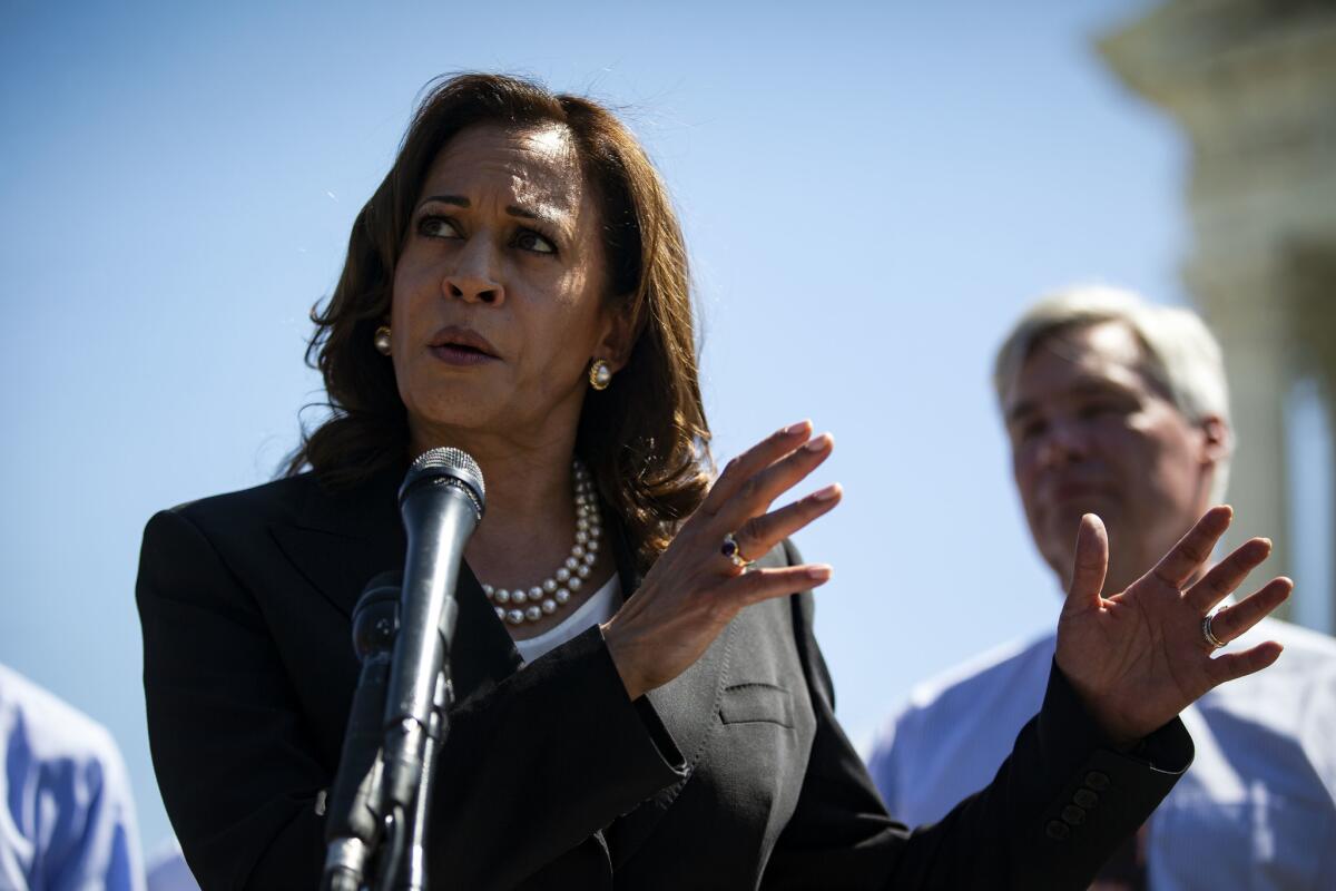 Sen. Kamala Harris speaks with Senate Democrats in front of the Supreme Court on July 10.