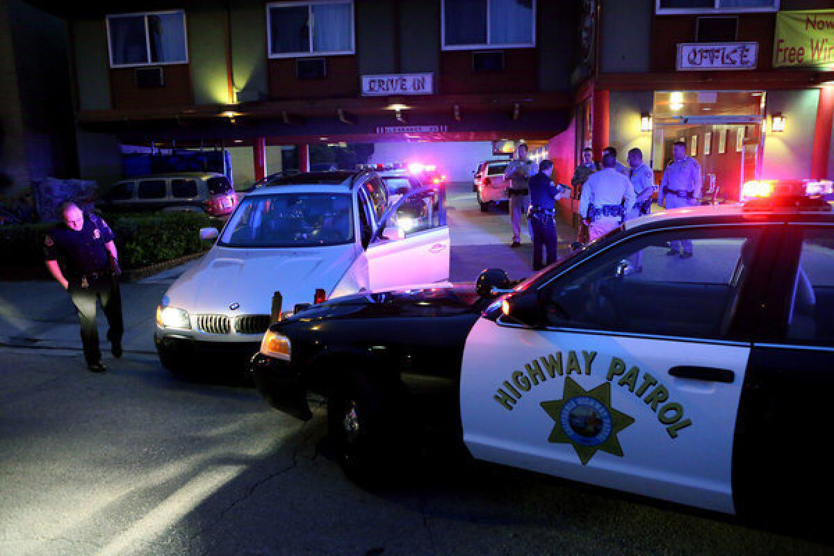 California Highway Patrol and Long Beach police officers investigate a pursuit that began in Long Beach and came to an end in Chinatown.