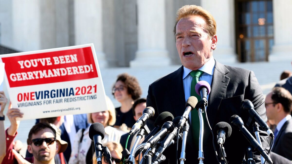 Former California Gov. Arnold Schwarzenegger speaks at a rally outside the U.S. Supreme Court on Oct. 3 on the need for fair redistricting, the drawing of political map boundary lines.