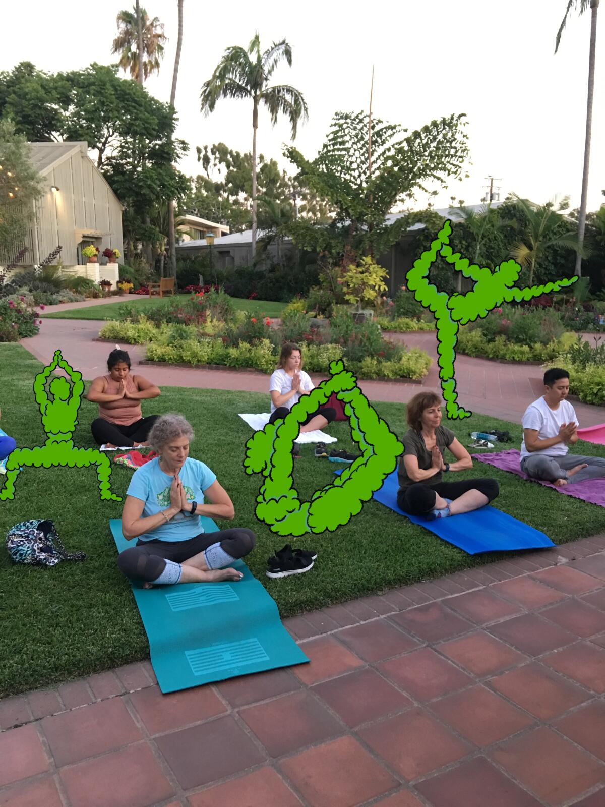 People practice yoga at the Sherman Library & Gardens in Corona del Mar.