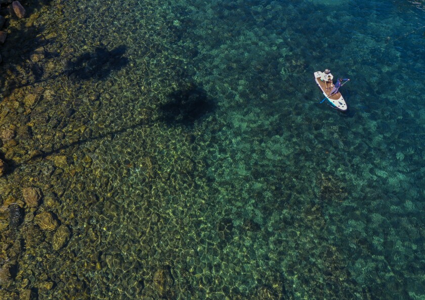 Paddleboarders ply the waters of Avalon Harbor.