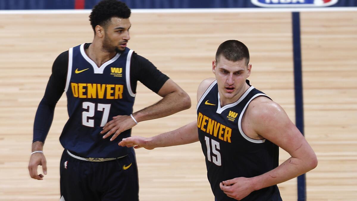 Guard Jamal Murray (27) and center Nikola Jokic (15) led the Nuggets to the No. 2 seed in the West this season.