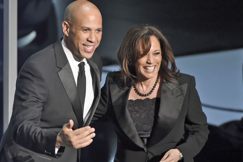Sen. Cory Booker, D-N.J., left, and Sen. Kamala Harris, D-Calif., speak at the 50th annual NAACP Image Awards on Saturday, March 30, 2019, at the Dolby Theatre in Los Angeles. (Photo by Chris Pizzello/Invision/AP)