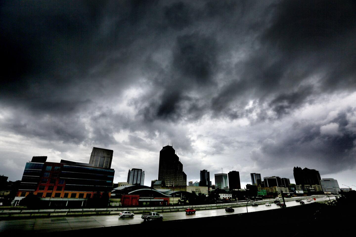 The first outer bands of rain from Hurricane Matthew pass over downtown Orlando, Fla., Thursday evening, Oct. 6, 2016.