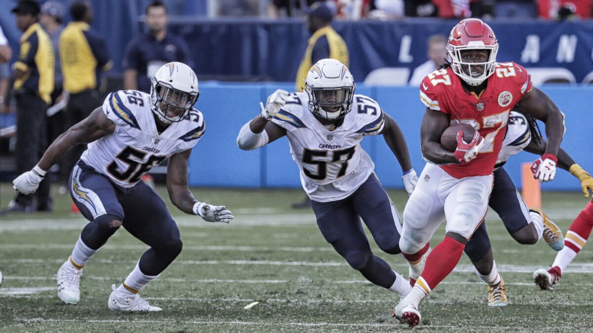 Chiefs running back Kareem Hunt breaks through the line for a 69 yard touchdown run to ice a 24-10 win over the Chargers.