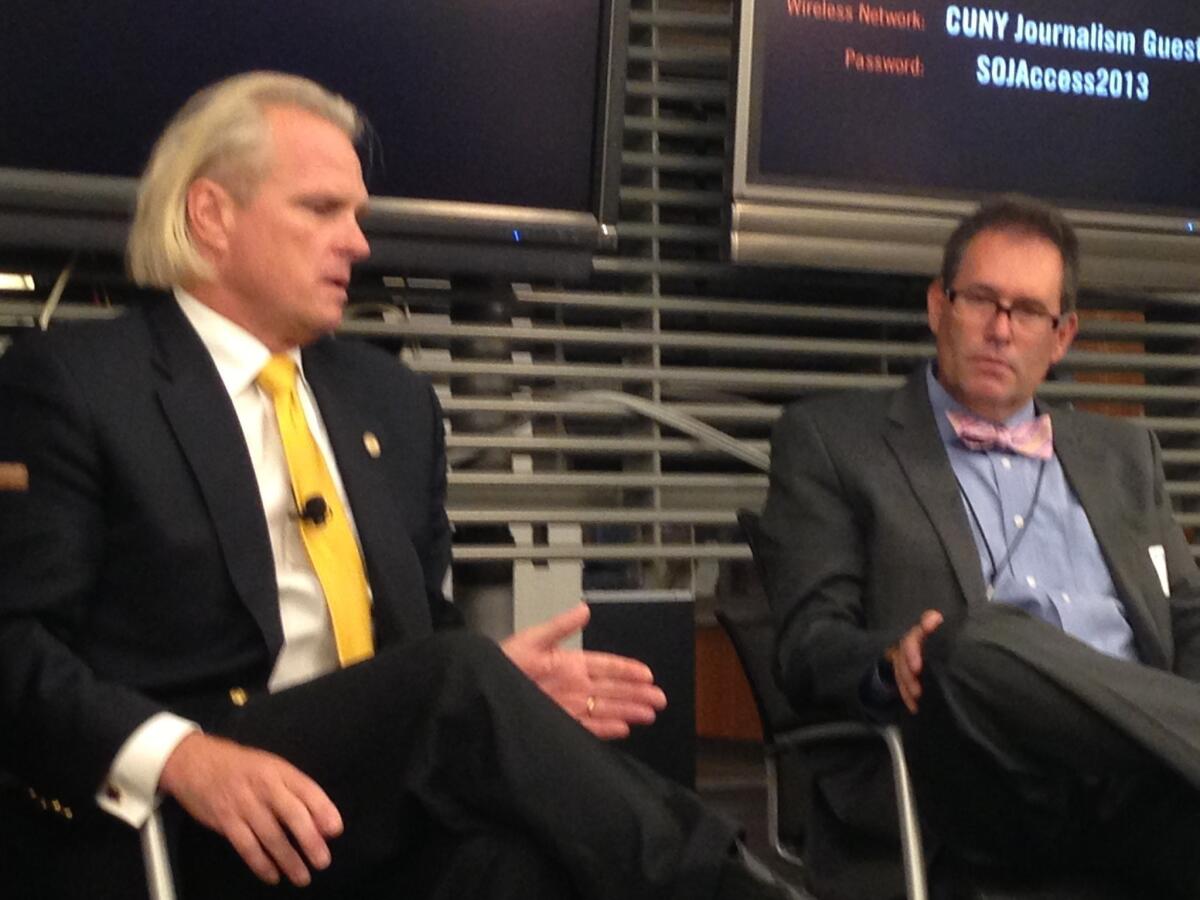 CFTC Commissioner Bart Chilton, left, speaks during a conference for business editors and writers in New York City.