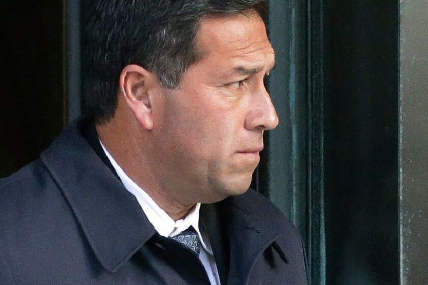 Jorge Salcedo, former UCLA soccer coach, departs federal court in Boston on Monday, March 25, 2019, after faceing charges in a nationwide college admissions bribery scandal. (AP Photo/Steven Senne)