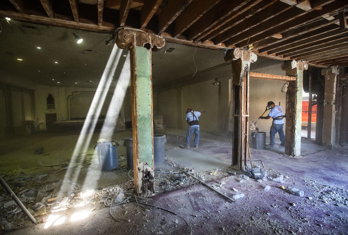 Sunbeams shine into a room that's under construction 