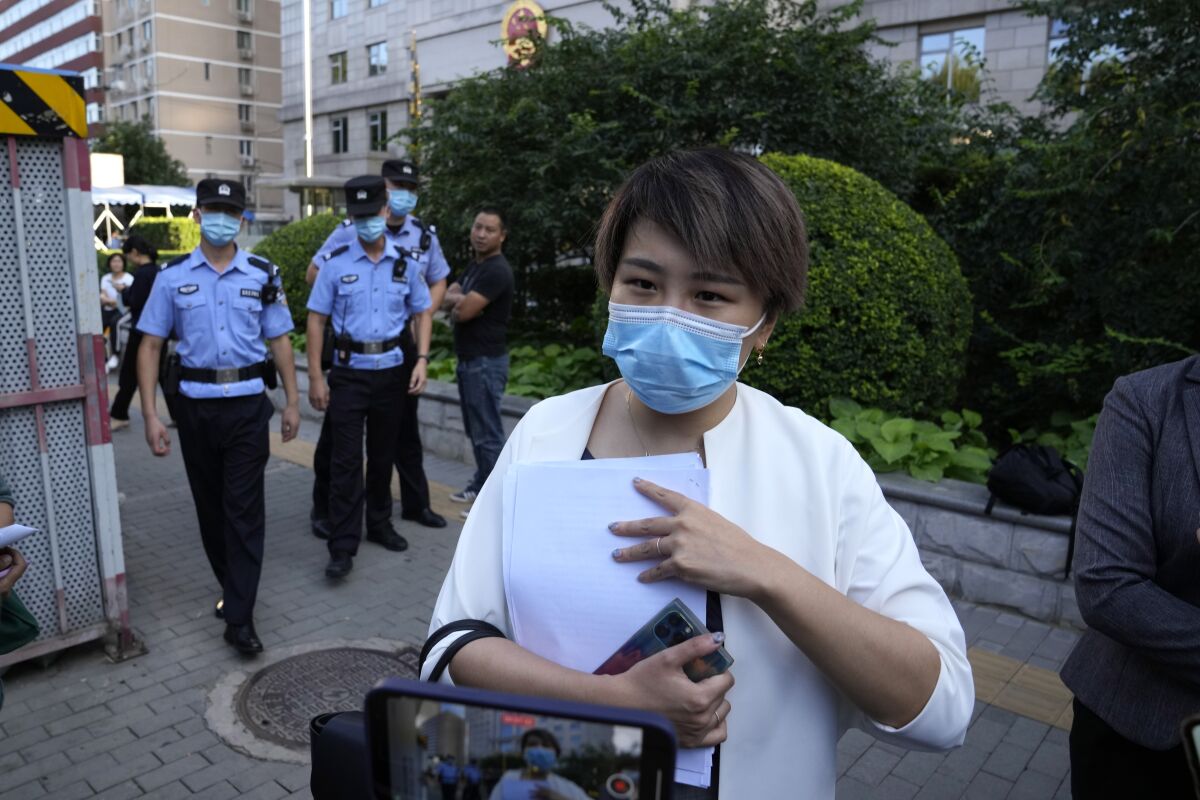 Teresa Xu speaks to journalists after her court session at the Chaoyang People's Court in Beijing, China on Sept. 17, 2021. A Beijing court overruled a rare legal challenge brought by the unmarried Beijing woman in court for the right to freeze her eggs on Friday, July 22, 2022. (AP Photo/Ng Han Guan)