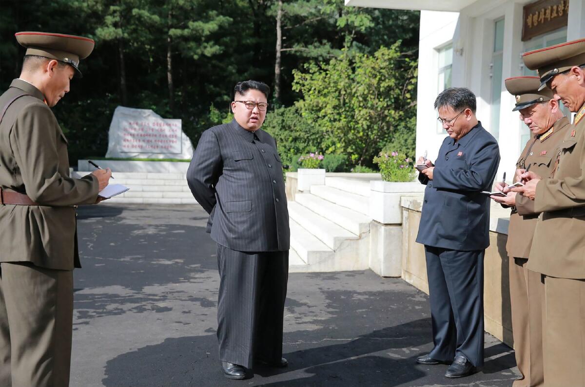 This undated picture released Aug. 23 by North Korea's official Korean Central News Agency shows North Korean leader Kim Jong Un visiting the Chemical Material Institute